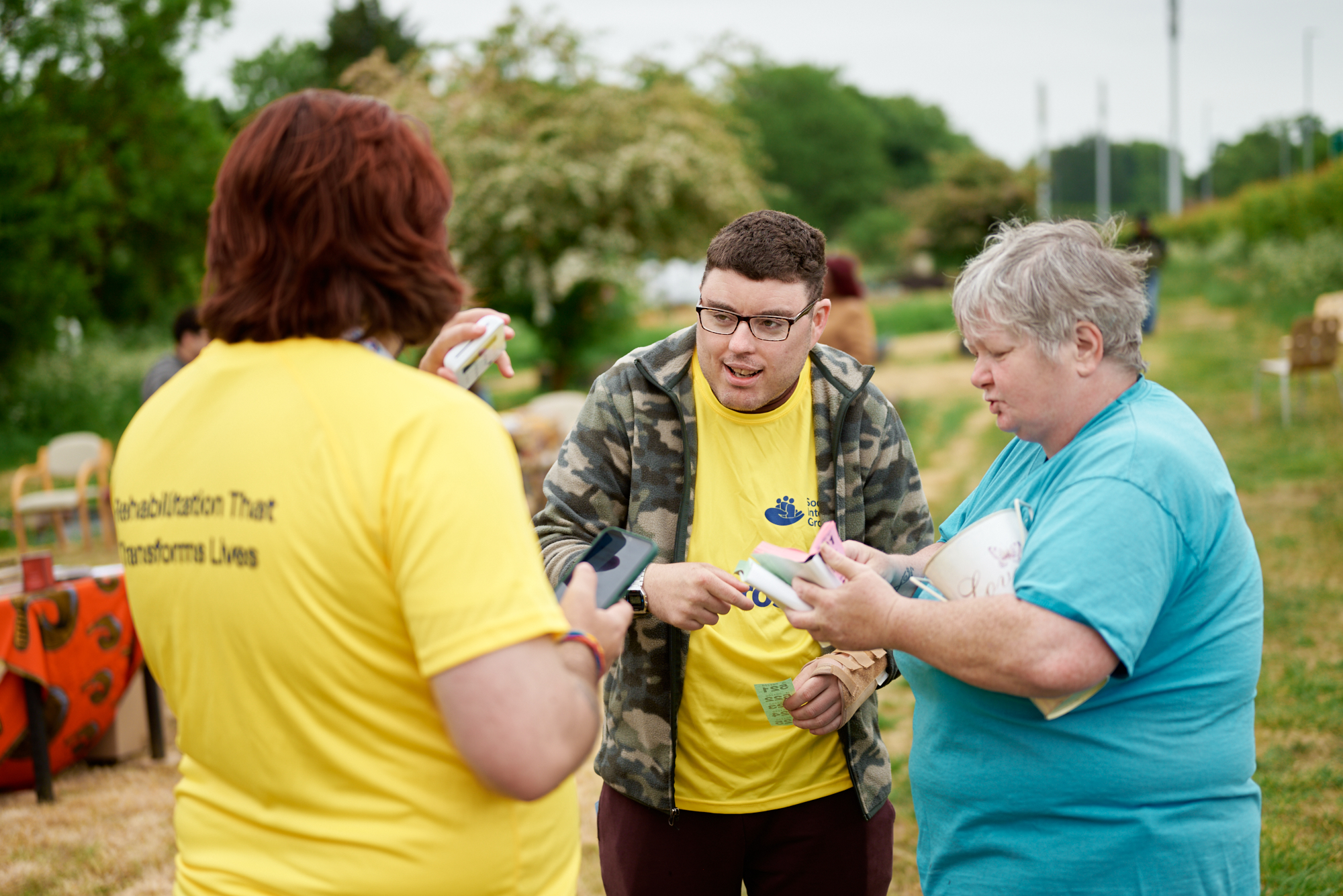 Volunteer and participant talking together outdoors